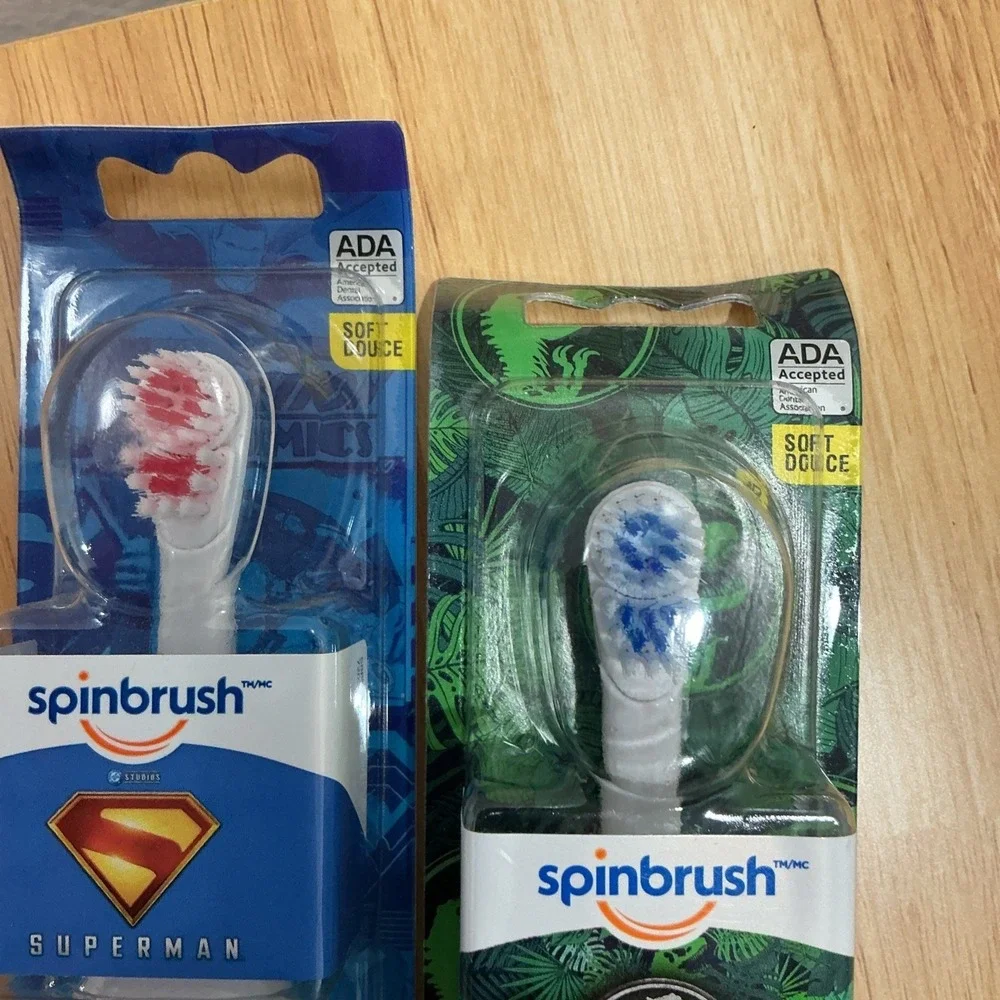 2x Bundle Spinbrush Superman & Jurassic Park Battery Powered Soft Toothbrush NEW